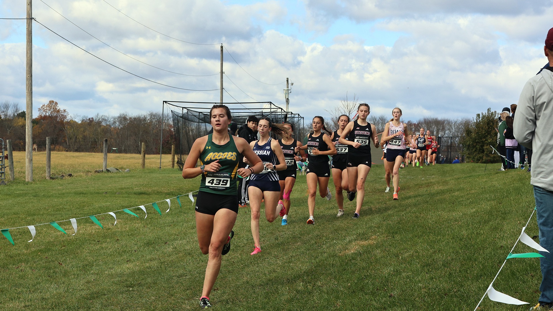 Emma Haas running cross country at MAC Championships