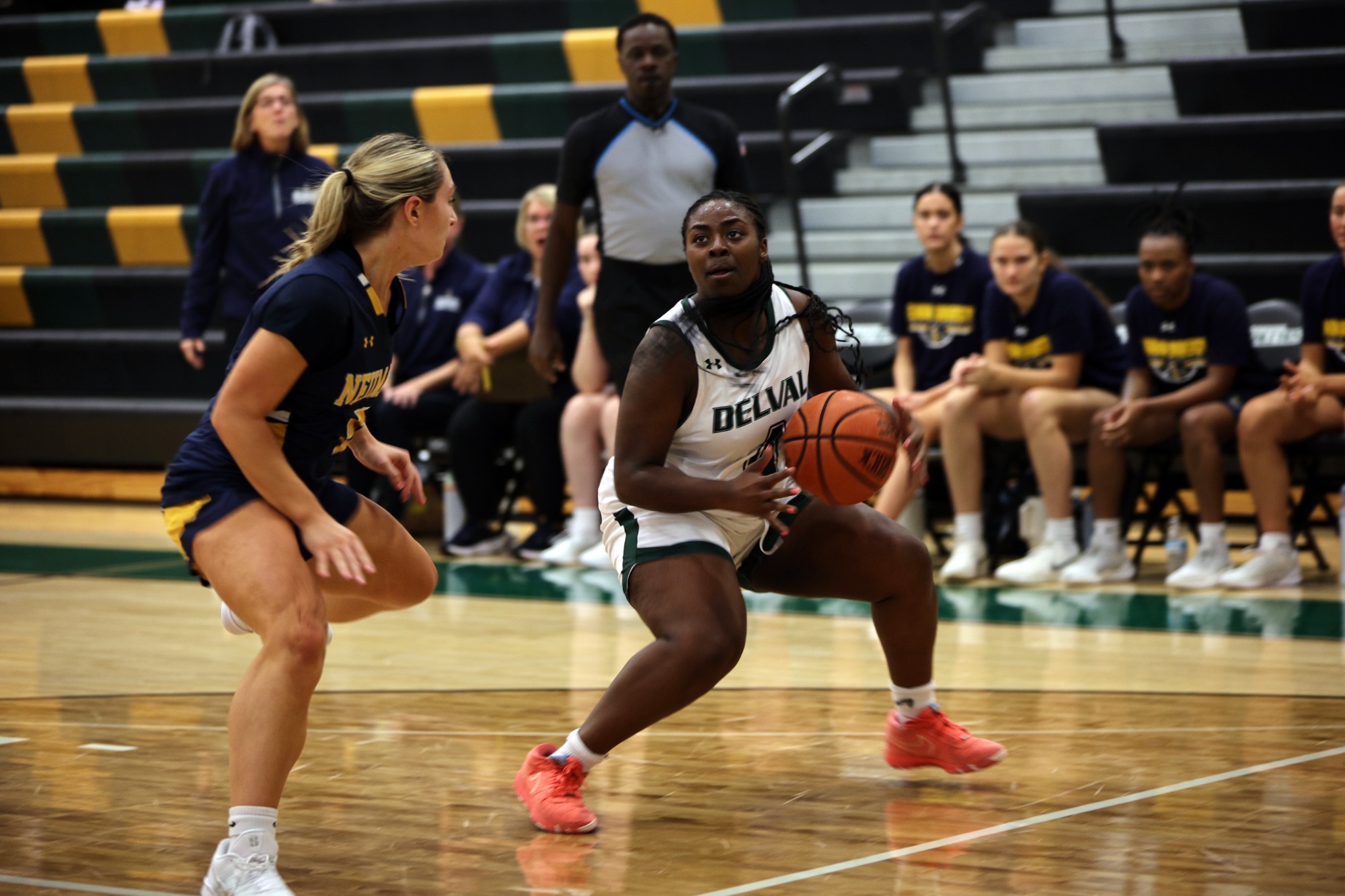 Whitney Evans playing women's basketball vs. Neumann