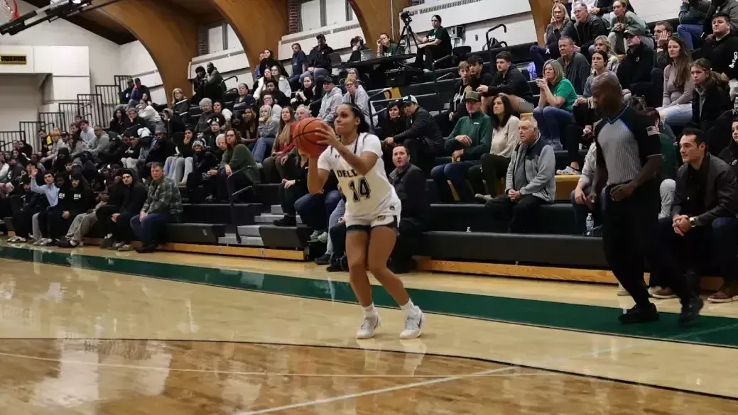 Ciana Feliciano playing women's basketball vs. Neumann