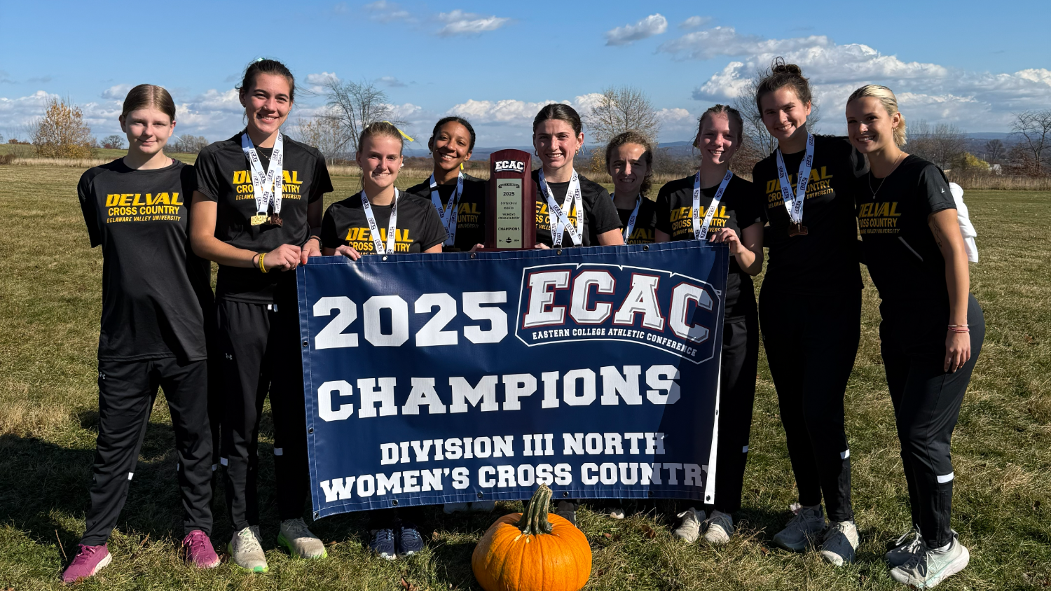 Women's cross country with championship banner at ECAC Championships