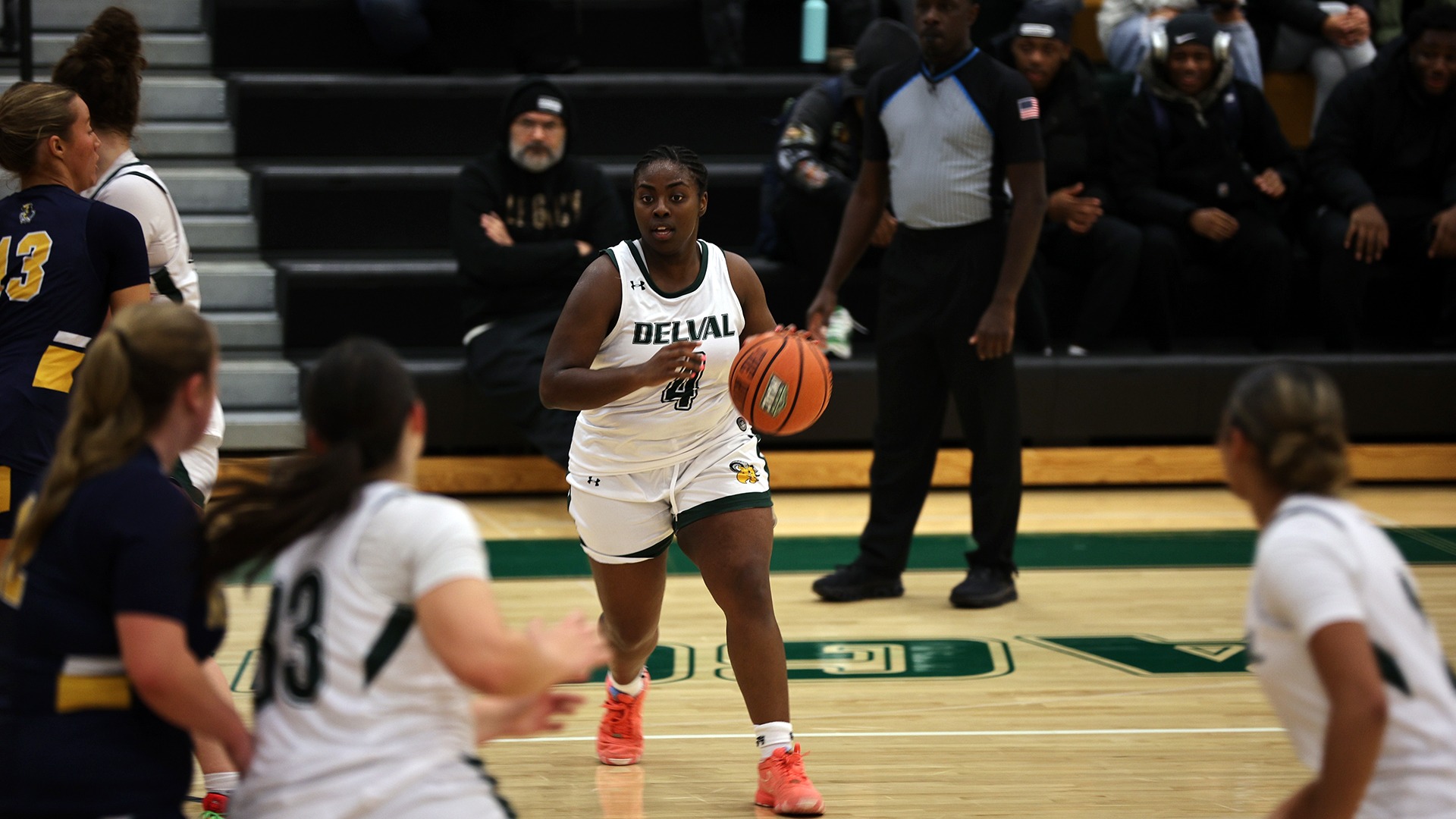 Whitney Evans playing women's basketball vs. Neumann