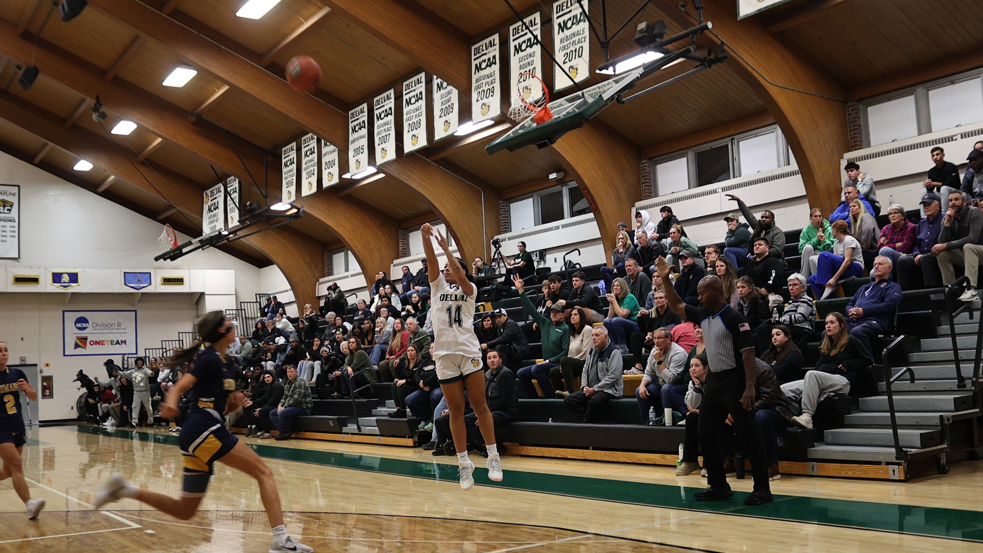 Ciana Feliciano playing women's basketball vs. Neumann