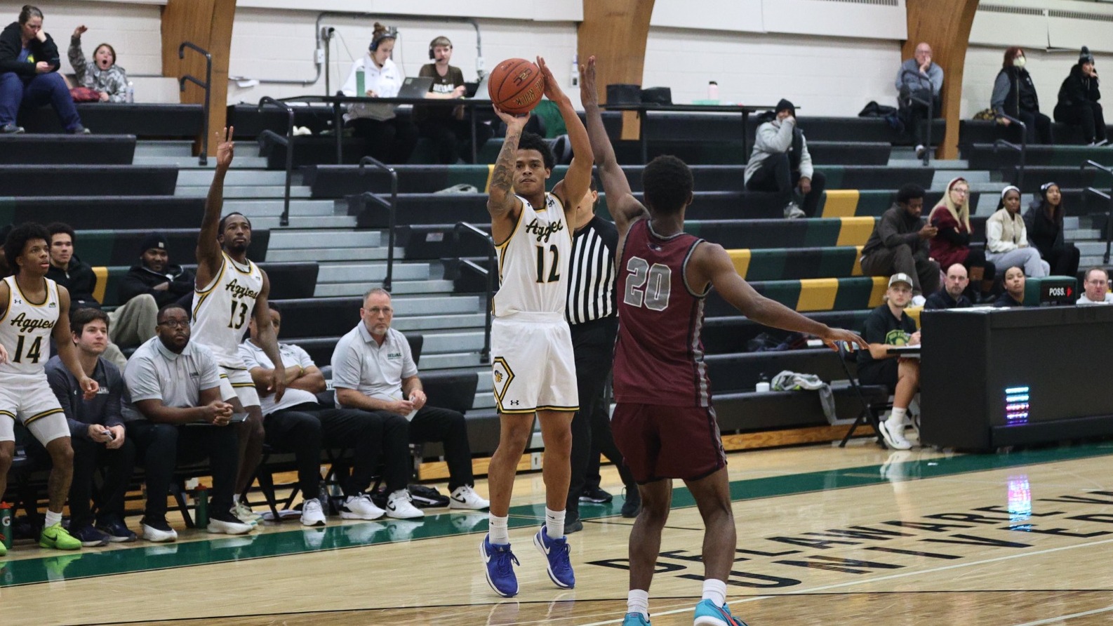 Jahan Owusu playing basketball against Rosemont