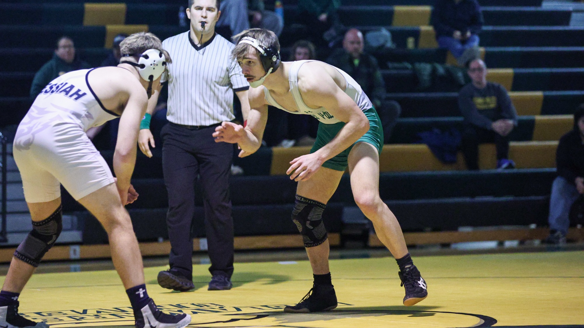 Luke Moore wrestling against Messiah