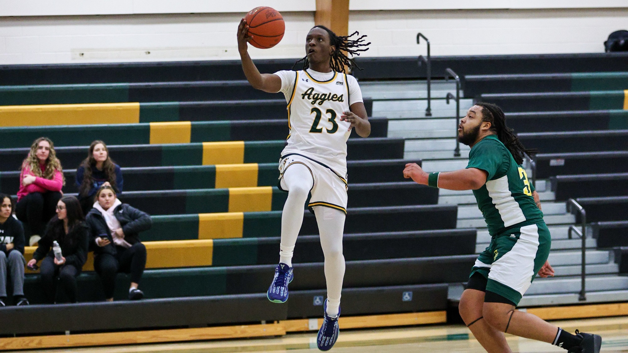JT Wright  playing basketball against New Jersey City
