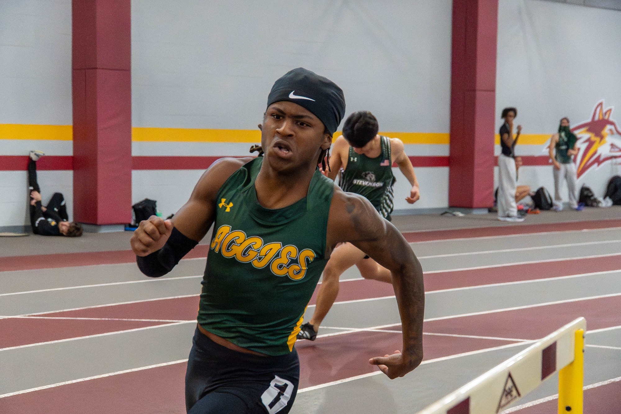 Jamar Robinson participating in track and field at the Alvernia Rust Buster 