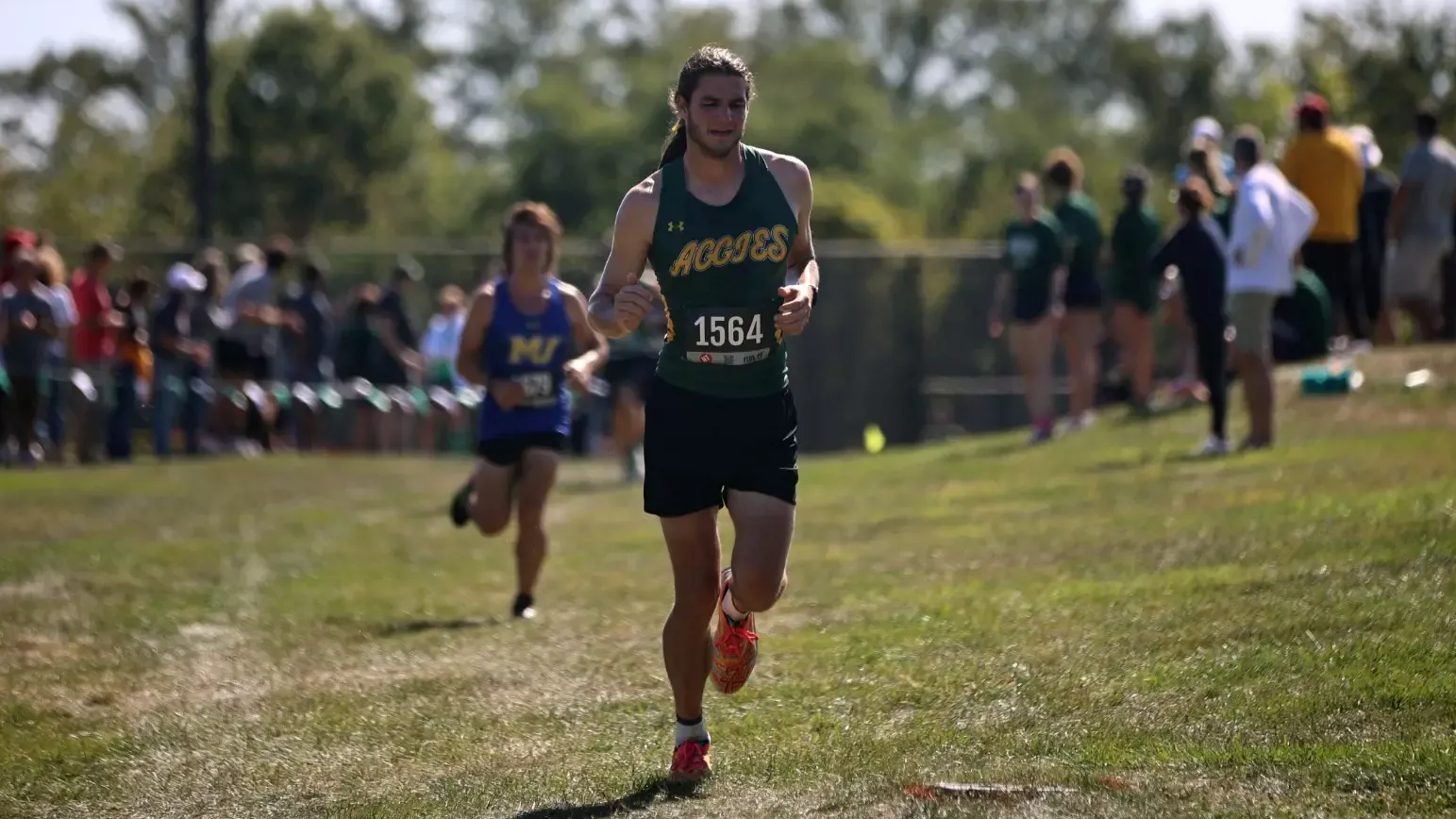 Jake Cammarota running cross country at the Aggie Open