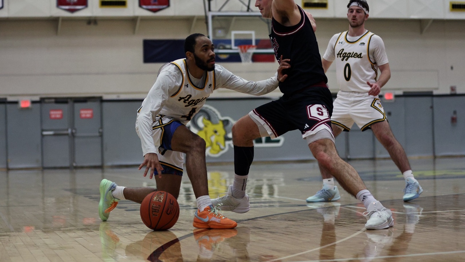 Kamal Johnson playing basketball against Stevens