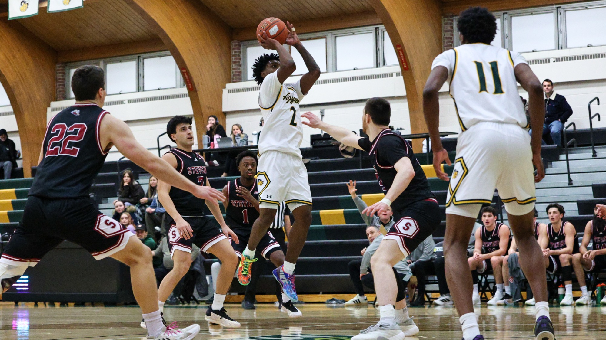 Antonio Redding playing basketball against Stevens IT