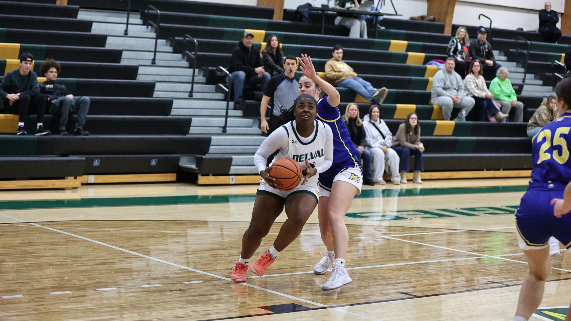 Whitney Evans playing women's basketball vs. Misericordia 