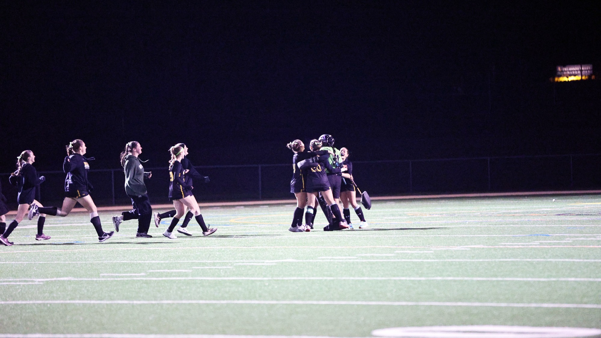 Field hockey celebrating win vs. King's 
