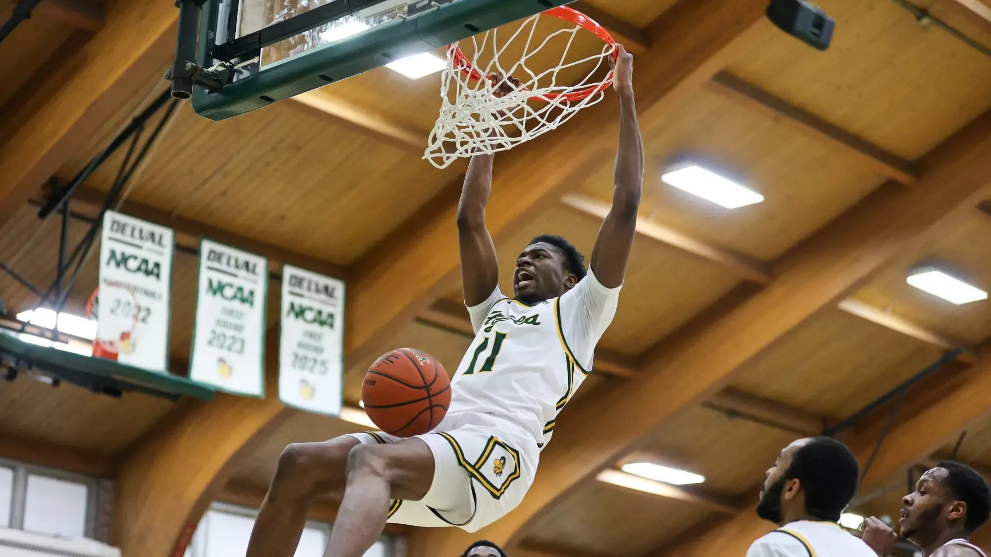 Brian Mordi playing basketball against Arcadia