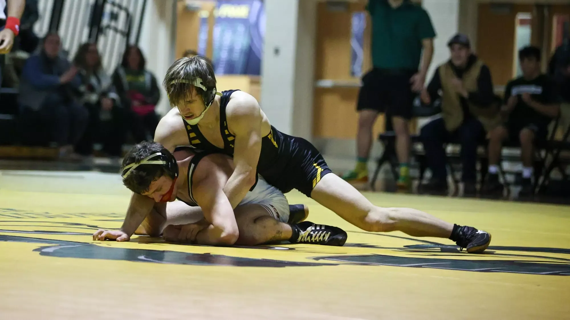 Luke Moore wrestling against Arcadia