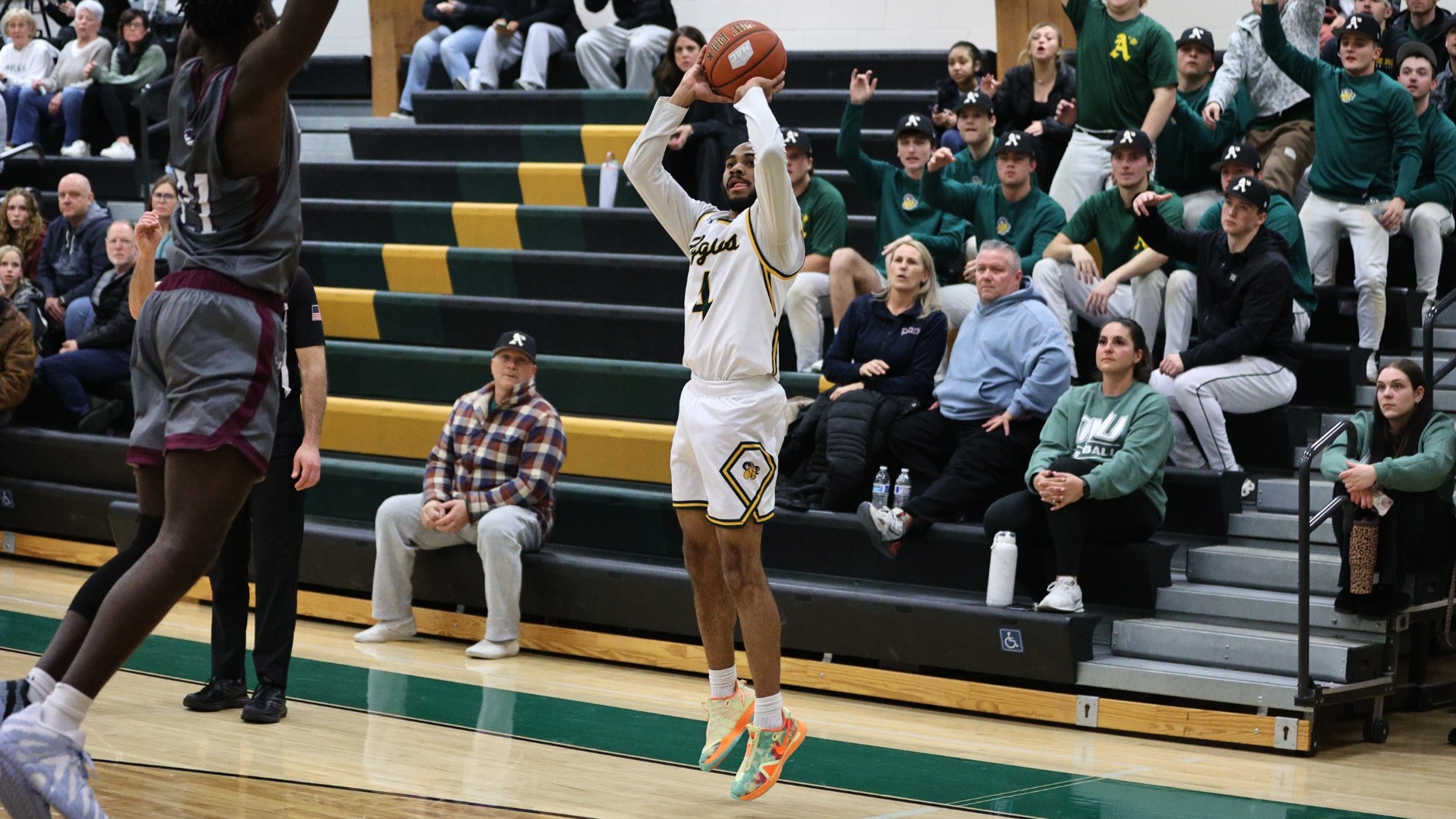 Kamal Johnson playing basketball against FDU-Florham