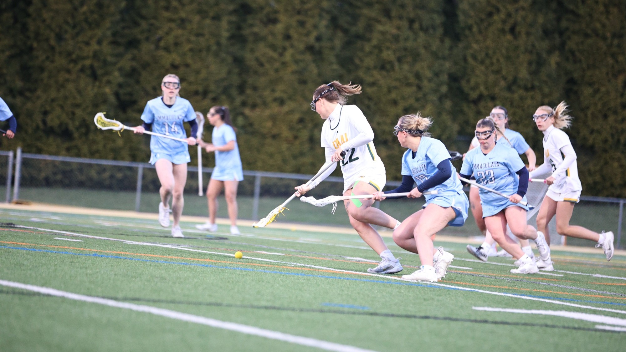 Abbie Hostetler playing lacrosse against Immaculata.