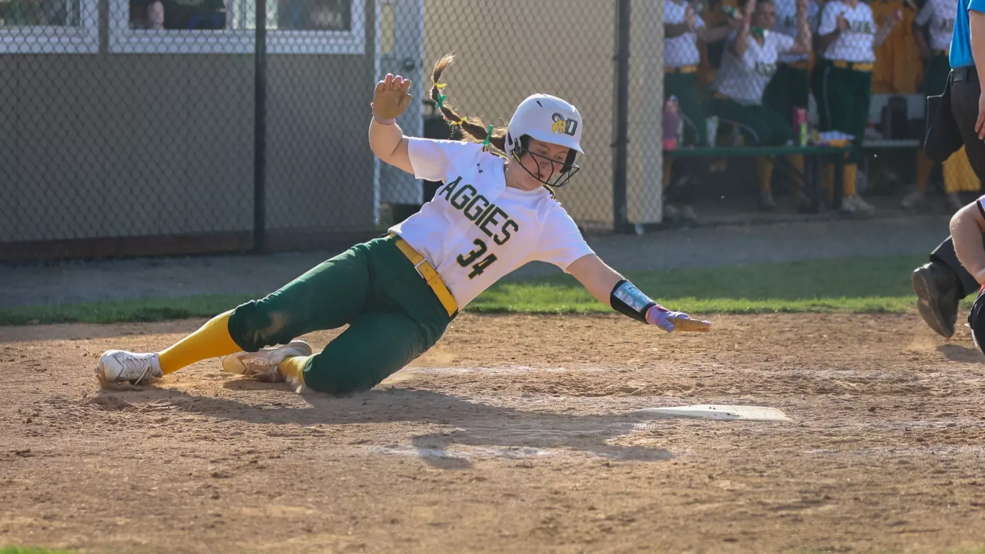 Laila Murray playing softball against Albright