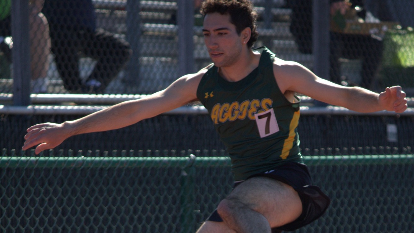 Jake Cammarota running hurdles at Messiah Invite