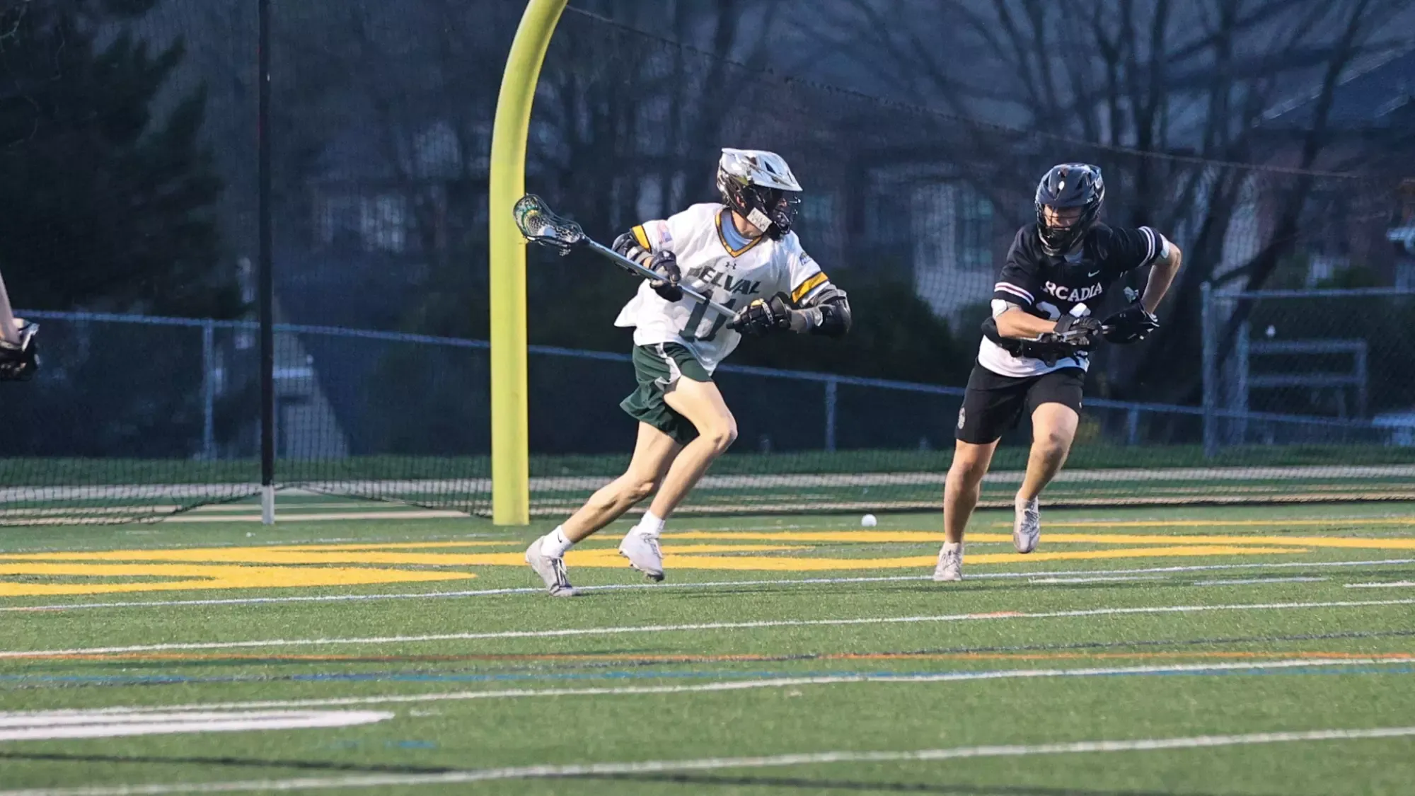 Jake Devereaux playing lacrosse against Arcadia