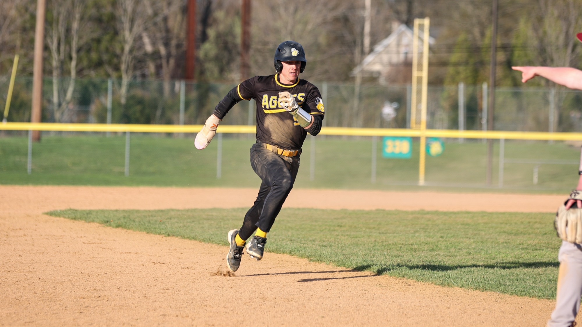 Nathan Fisher playing baseball against Cairn