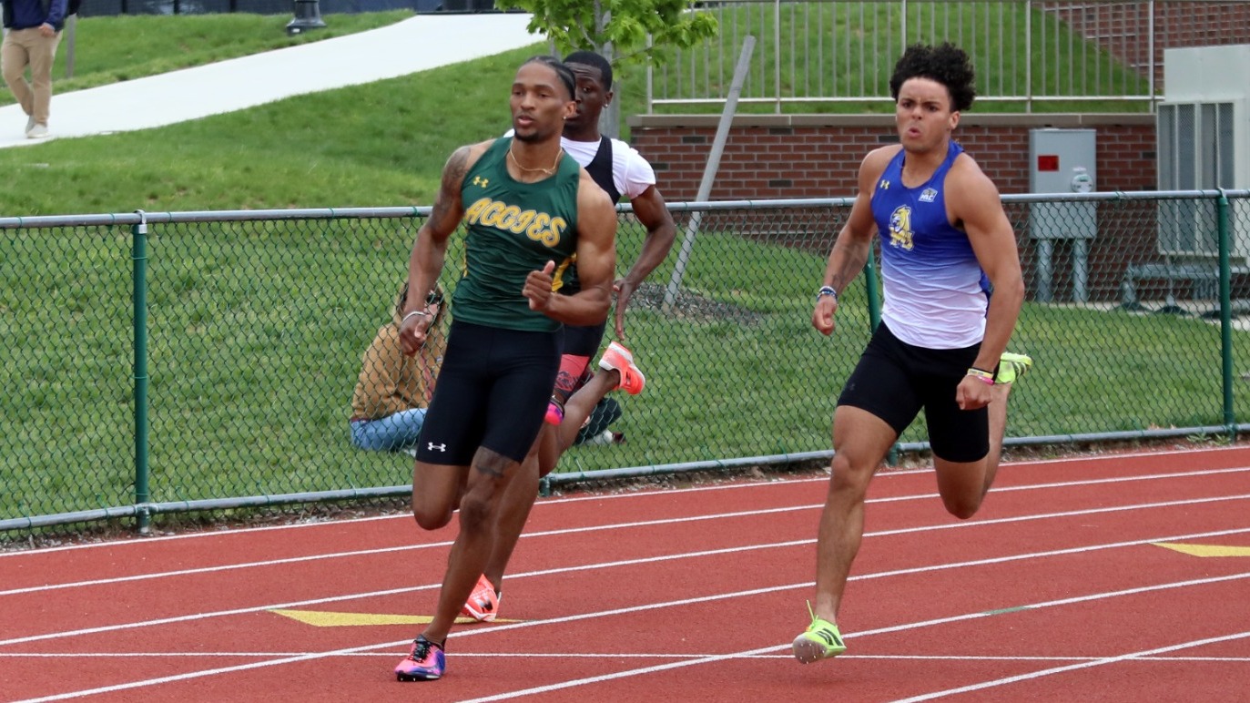 Victor Cruz running track at MAC Championships