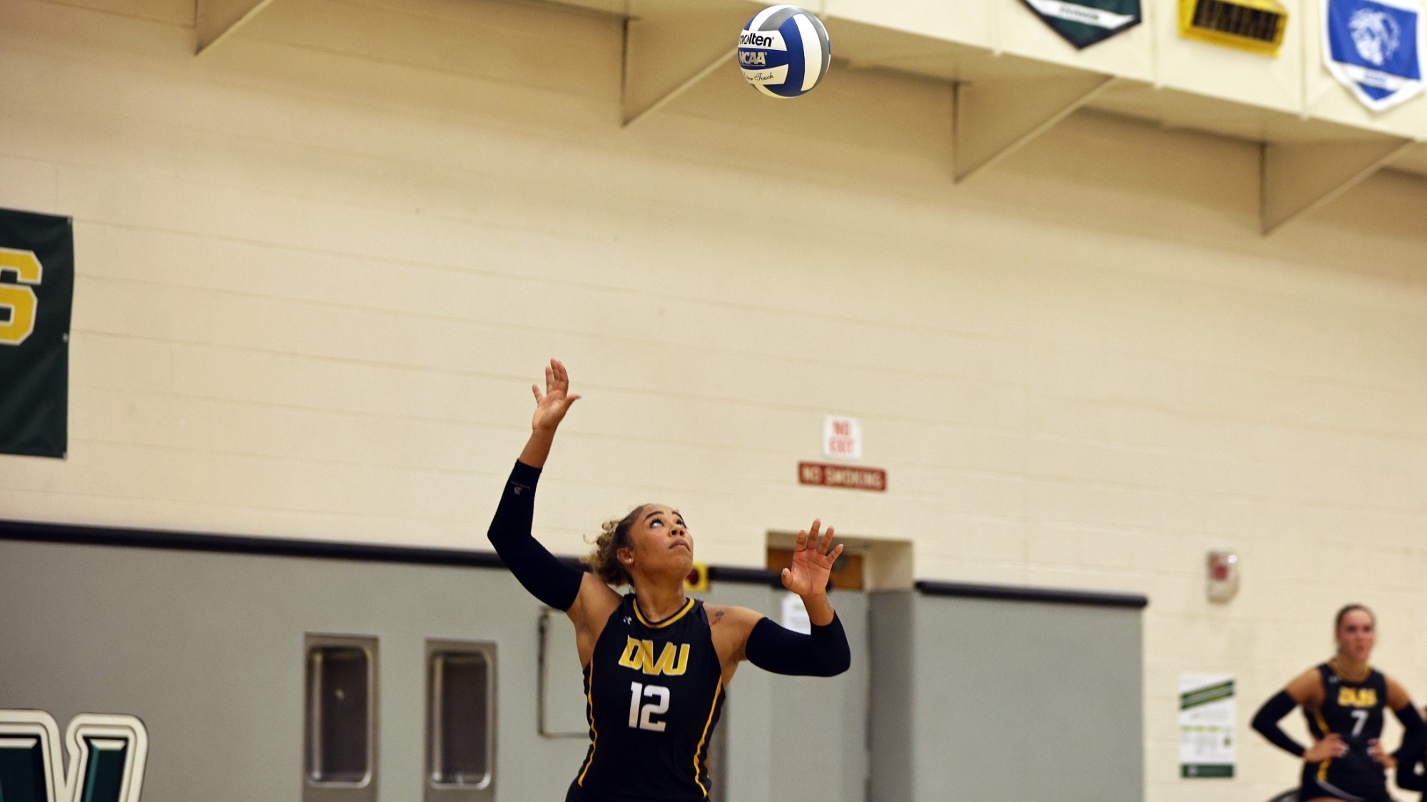 Monique Smith playing women's volleyball vs. Immaculata