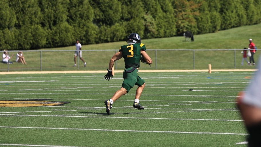 Wyatt Younes playing football against Albright