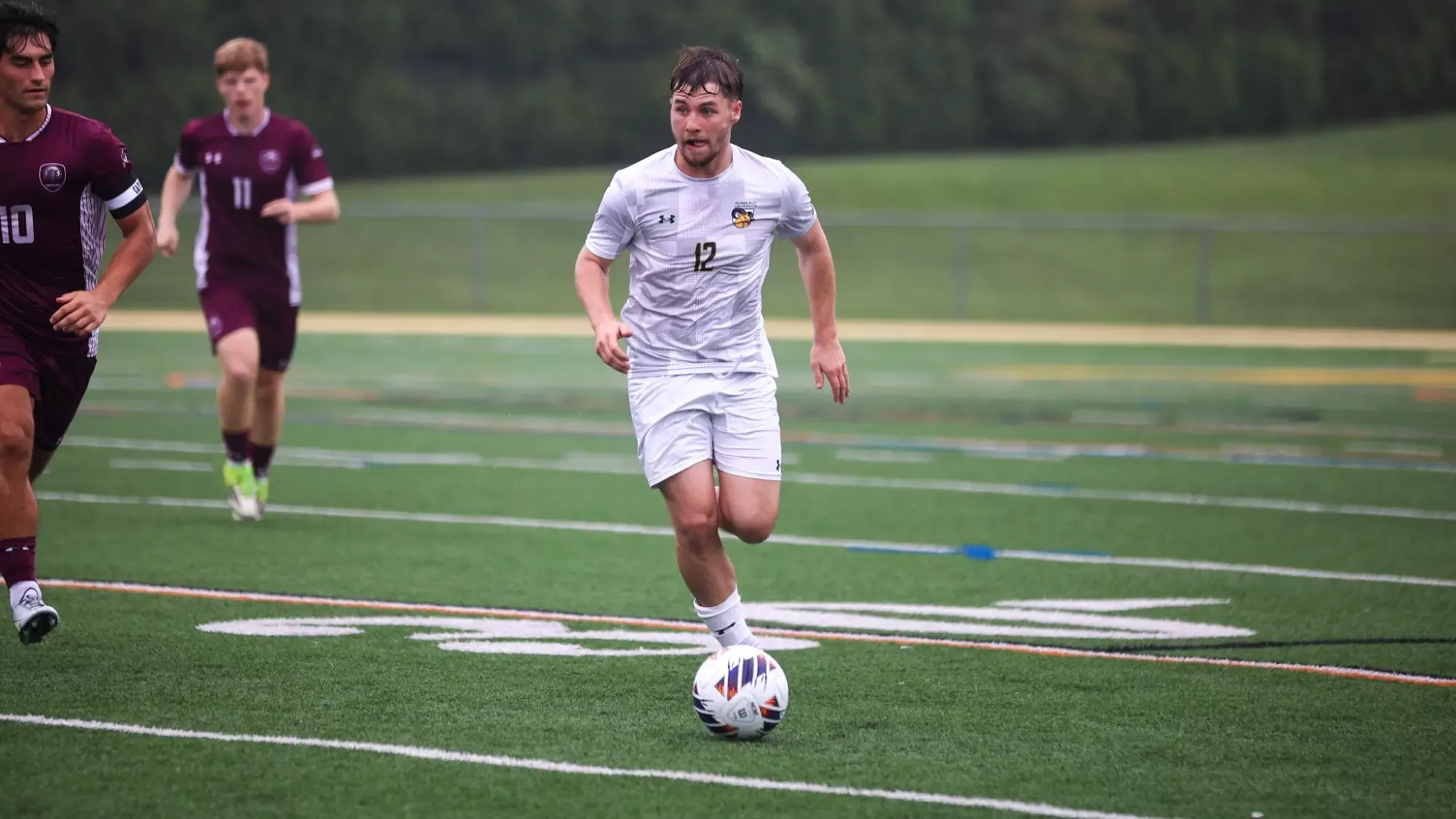 Everett Kurtz playing soccer against Eastern