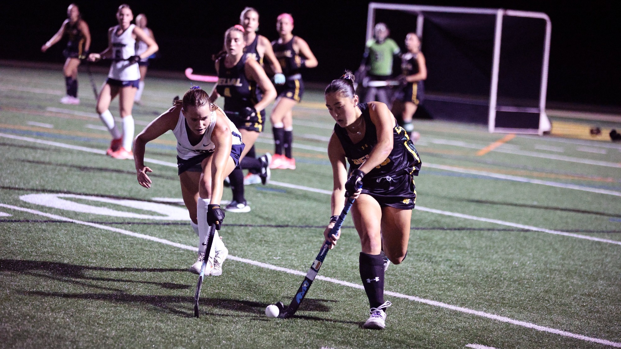 Jillian Collins playing field hockey vs. Drew