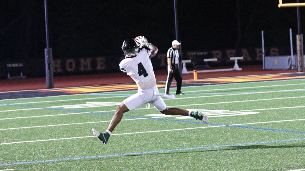 Mike Dunn playing football against Ursinus