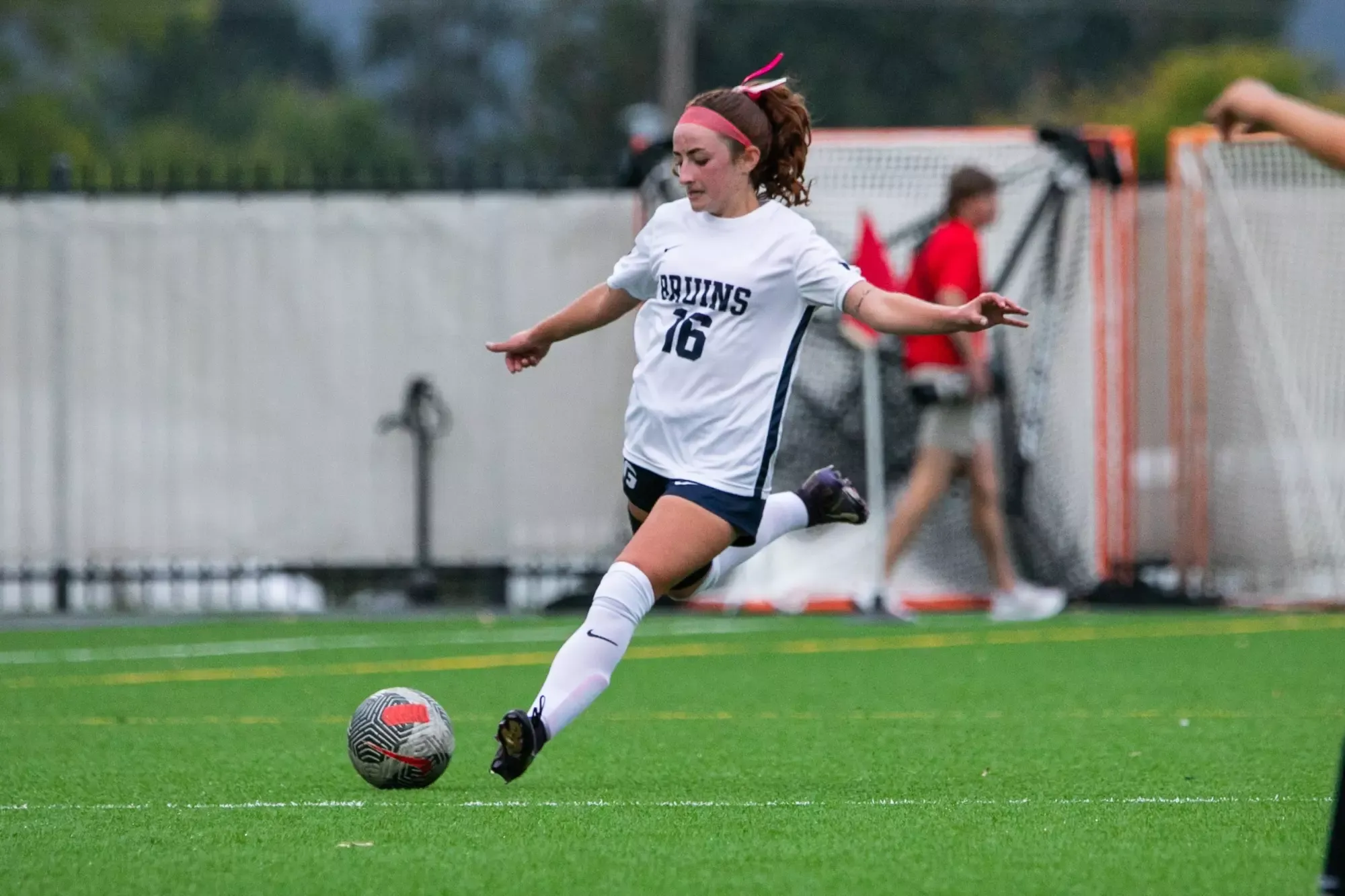 Rylee Gaylon kicking soccer ball