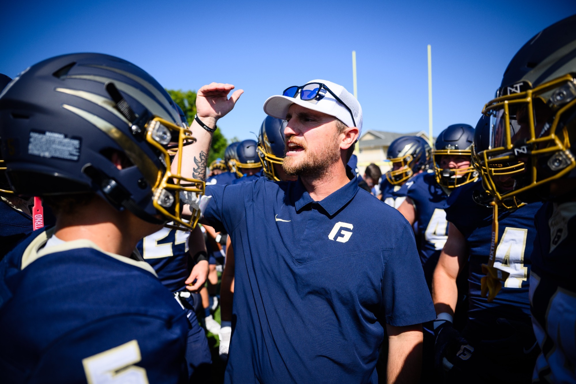 Spencer Crace talks to his team