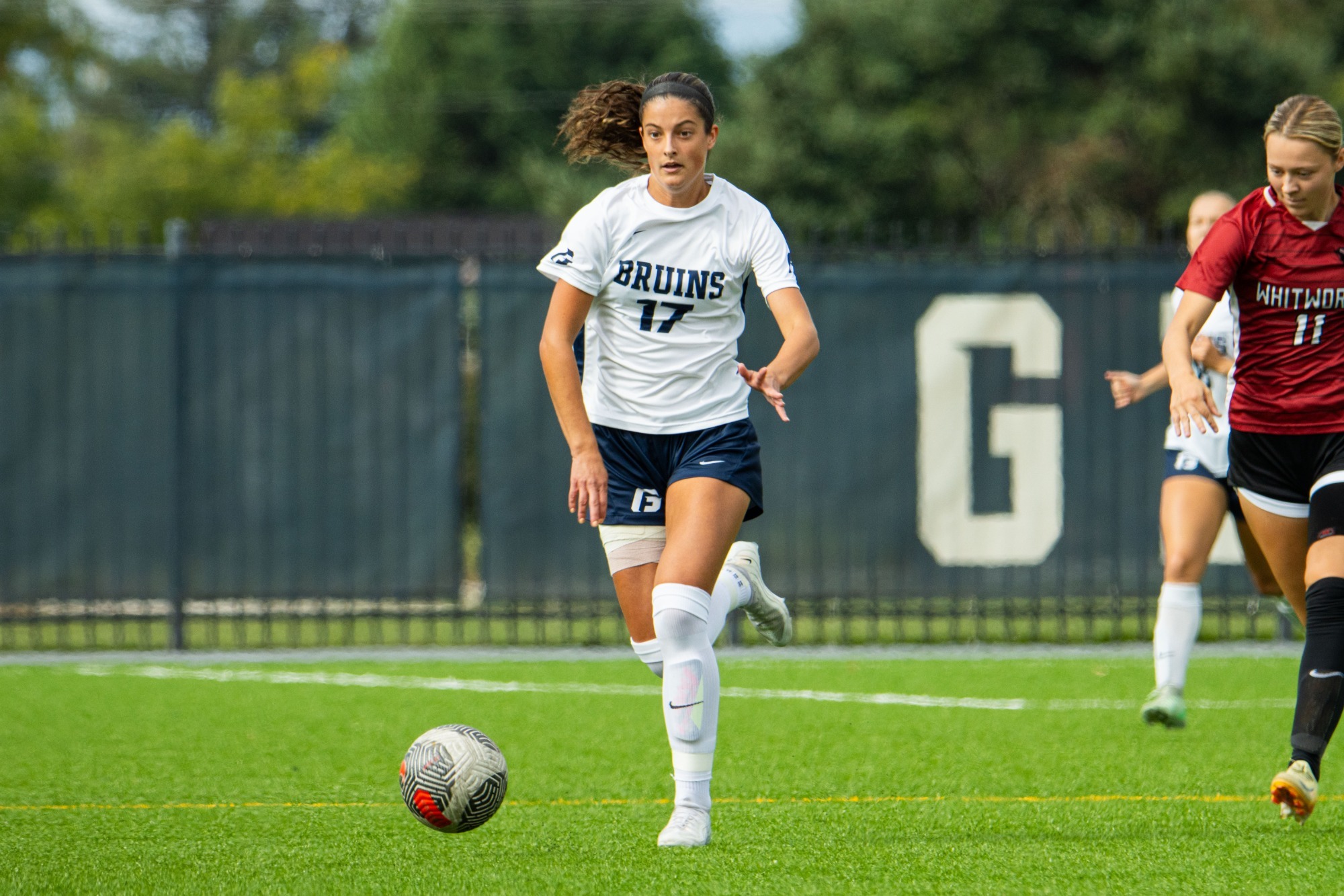 Liv Haima has ball at her feet looking up no one around 
