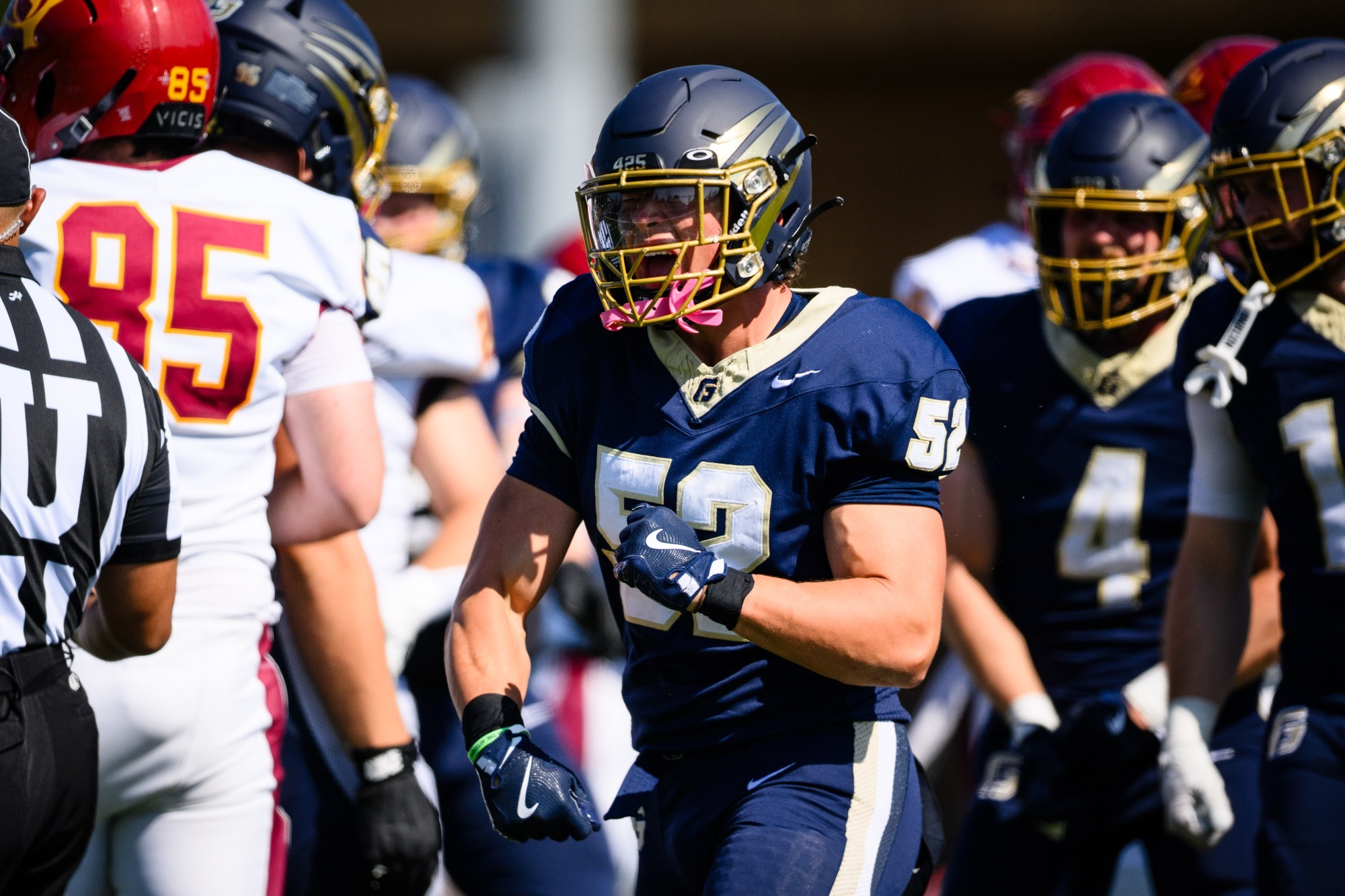Jacob Erickson celebrating a sack against CMS