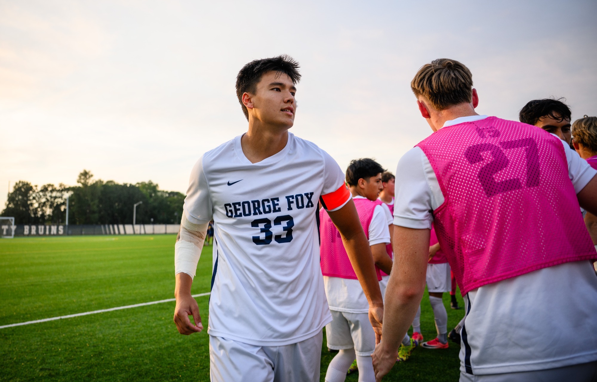Kilinahe Waring high fiving someone in warmup line 