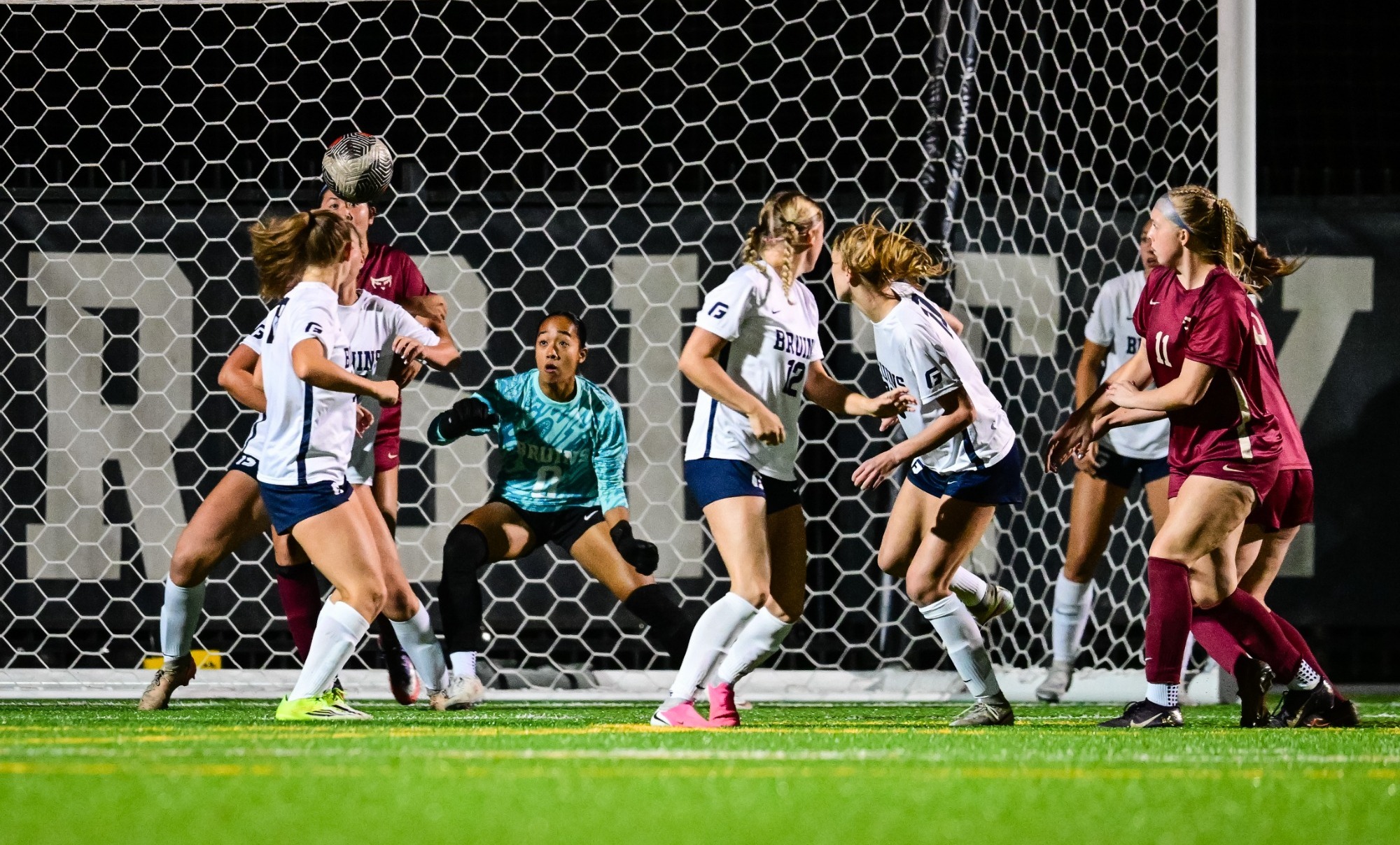action in the goal with multiple players