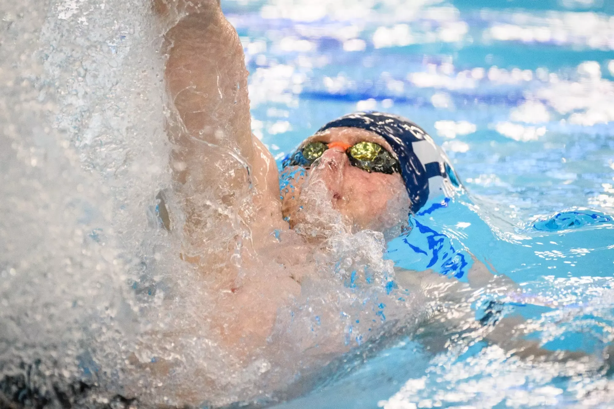 Athlete in water swimming for George Fox