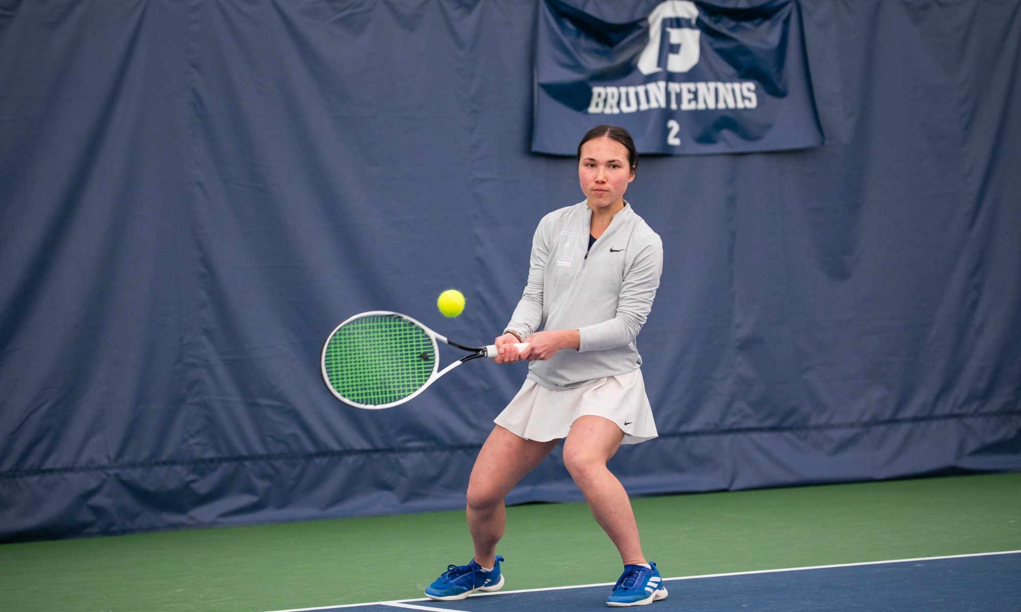 Sophie Denham swinging at a ball