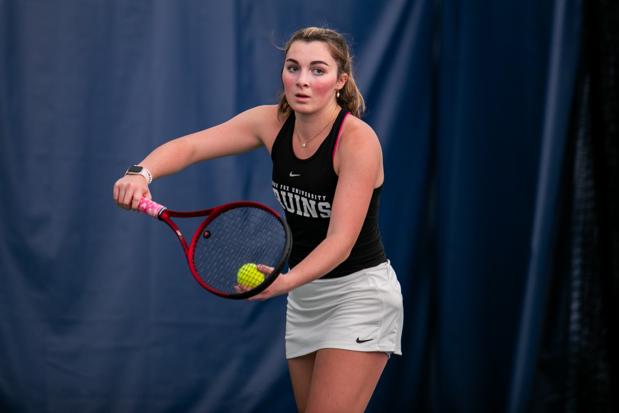 Riley Bobkiewicz gets ready to toss tennis ball in air