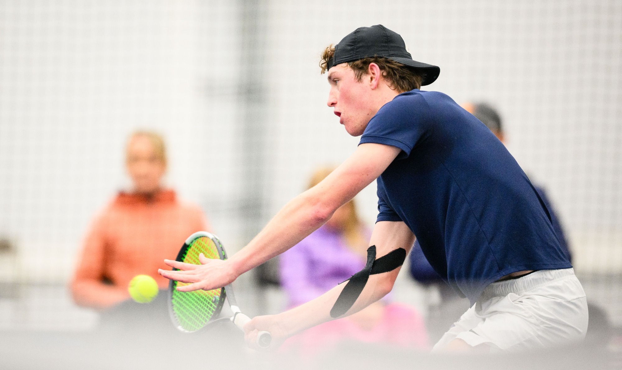 Aiden Cruz swinging racket