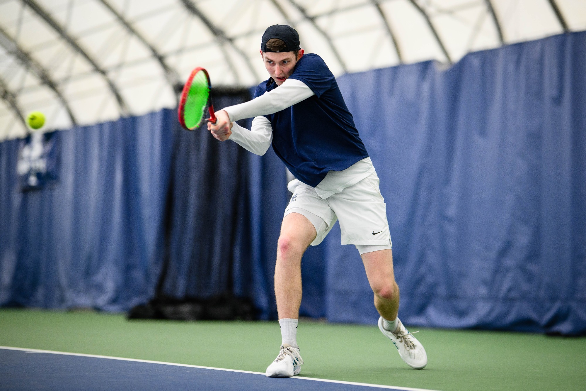 Zach Moore, swinging racket