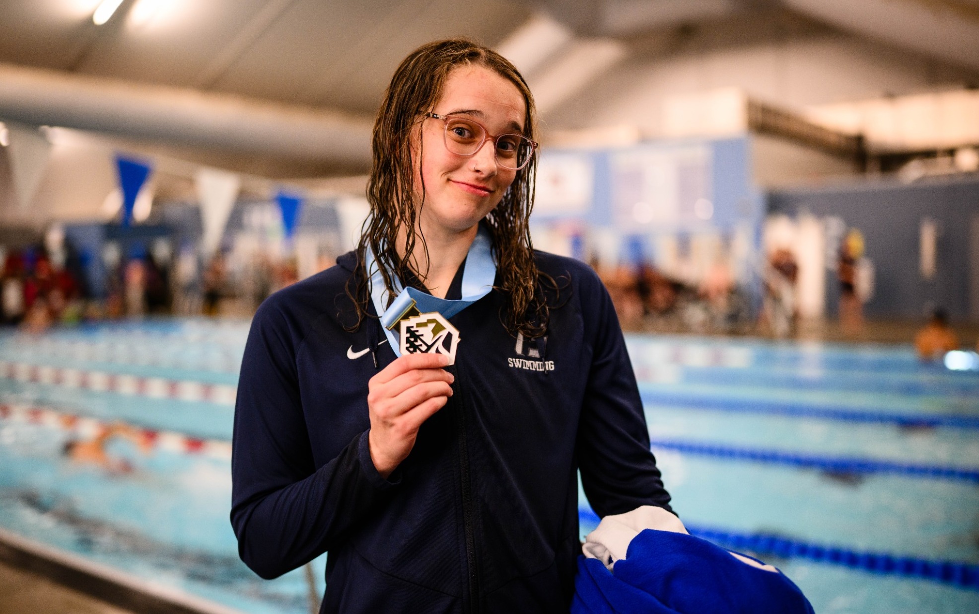 Gabbie Patti holding medal at Northwest Conference Championships 2026