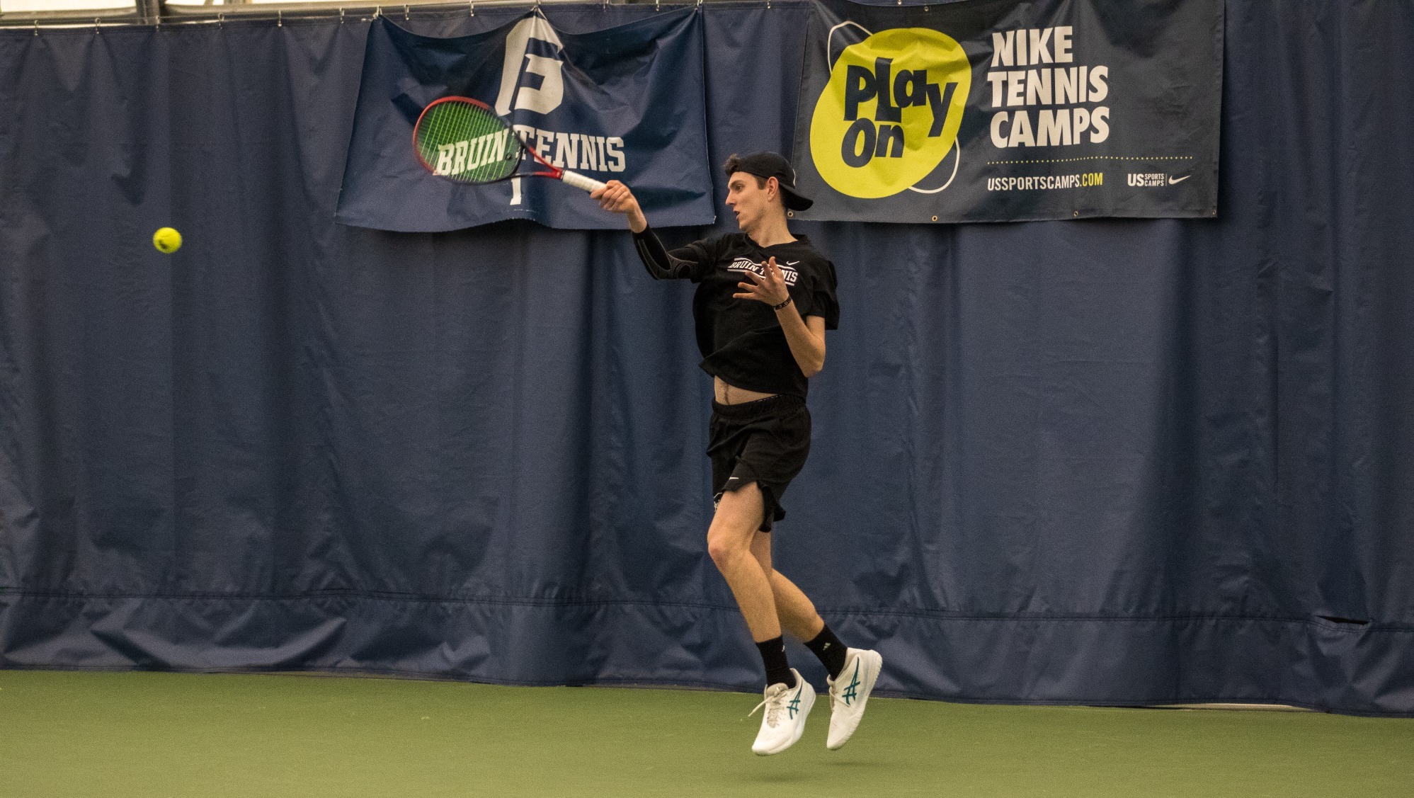 Zach Moore swinging racket