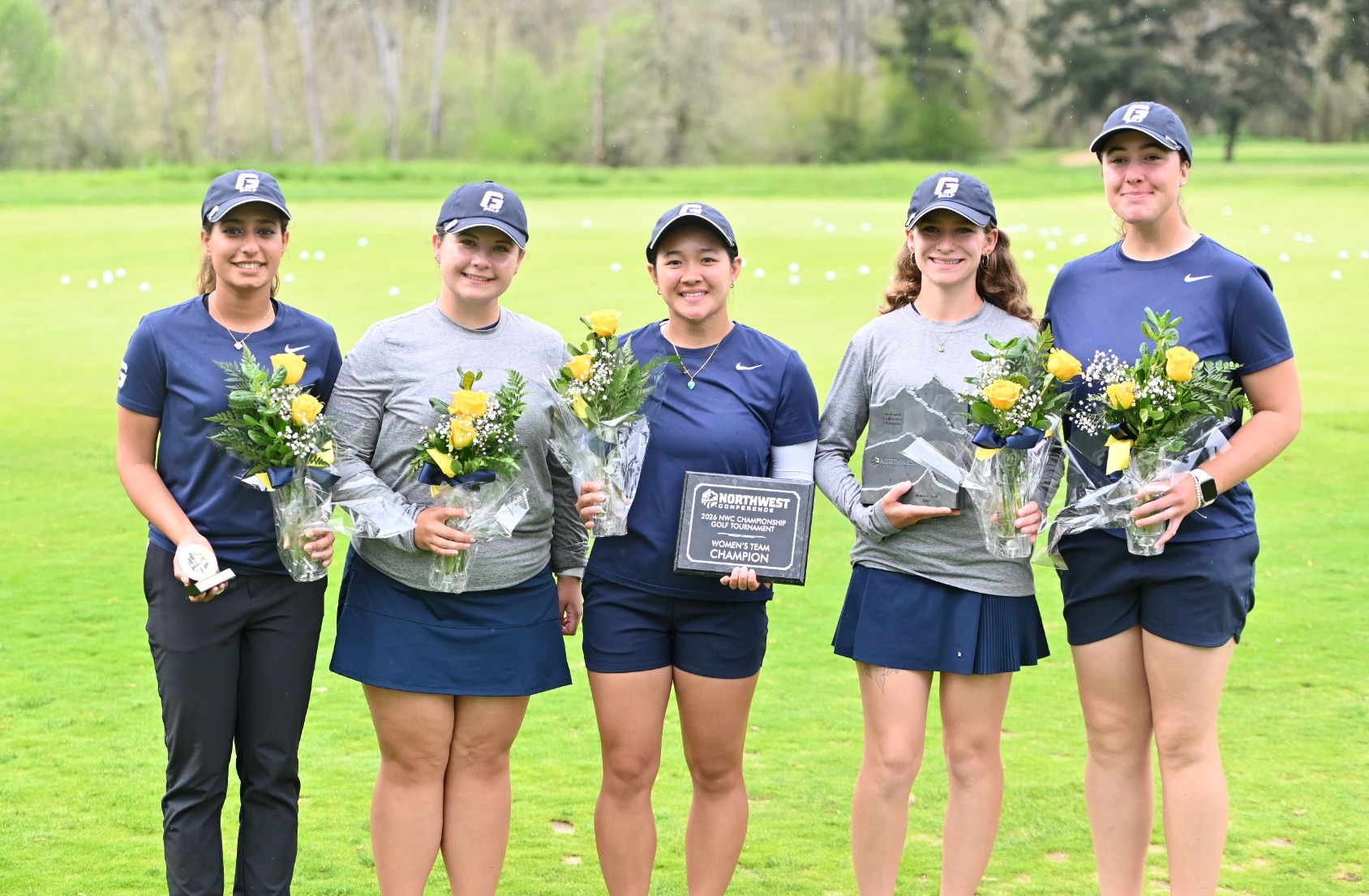 Bruins stand with trophy