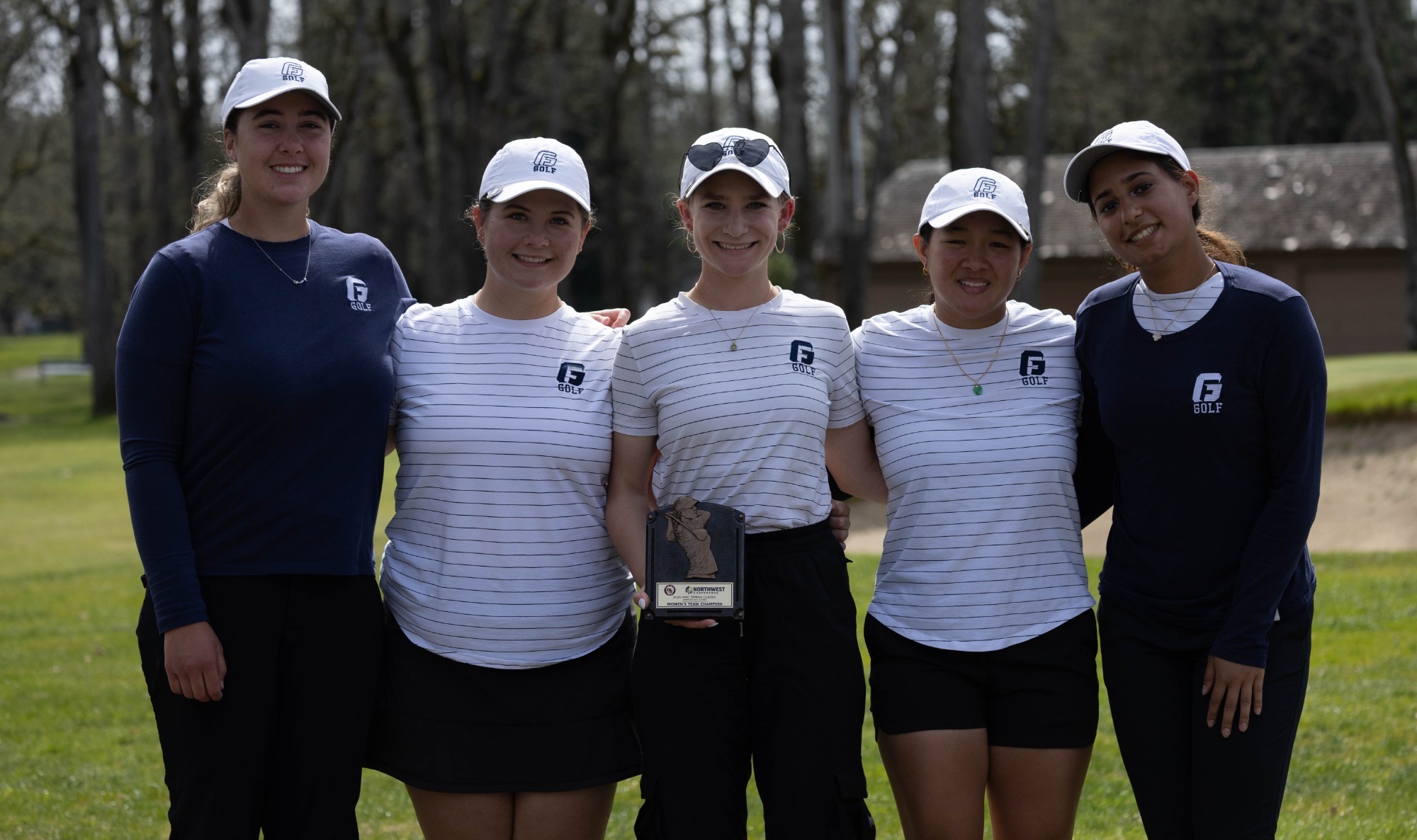 Bruins standing with award