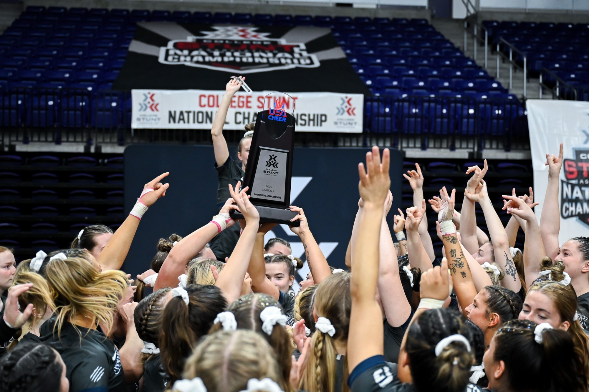 Holding the National Championship Trophy