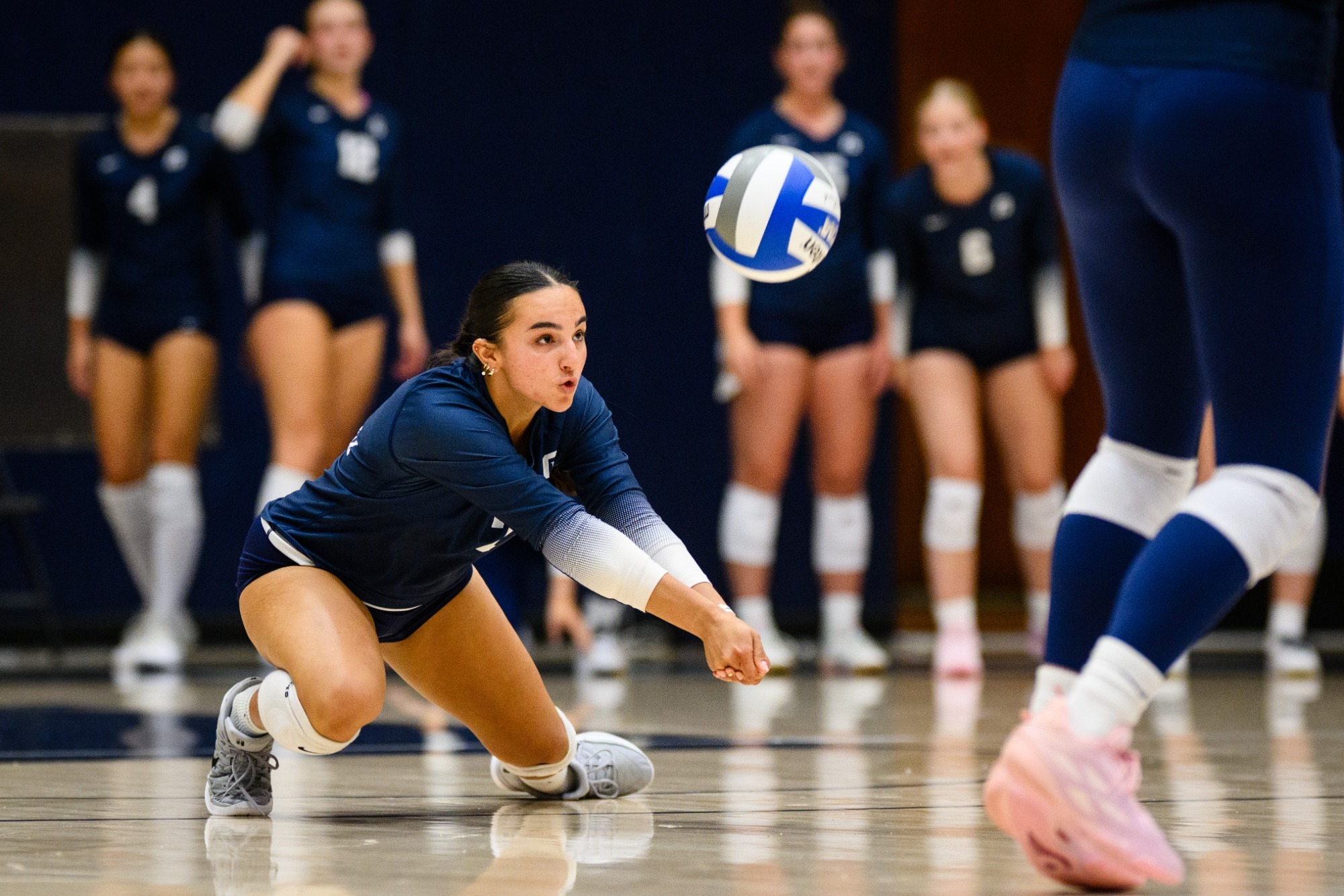 LeAna Cimarra diving for a ball