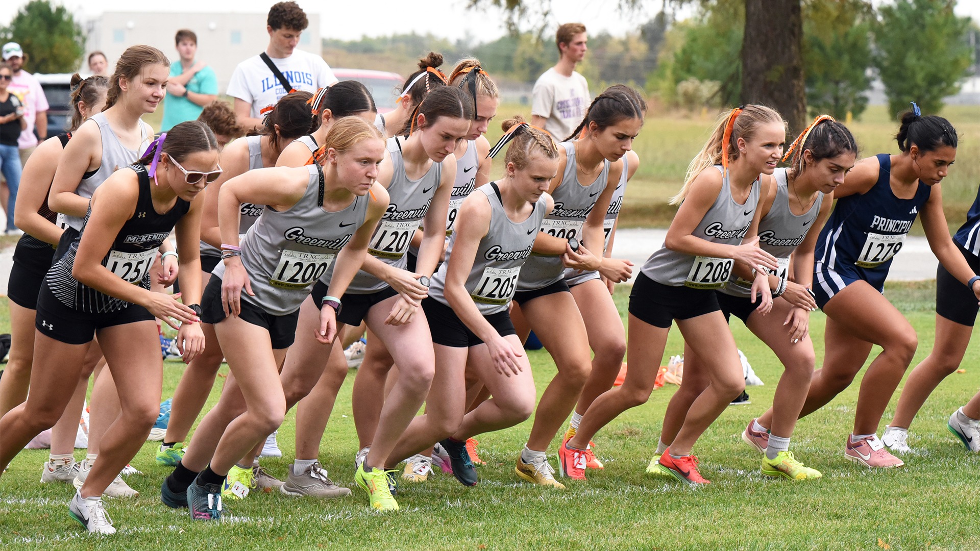 Group of Greenville runners at beginning of race, taking off