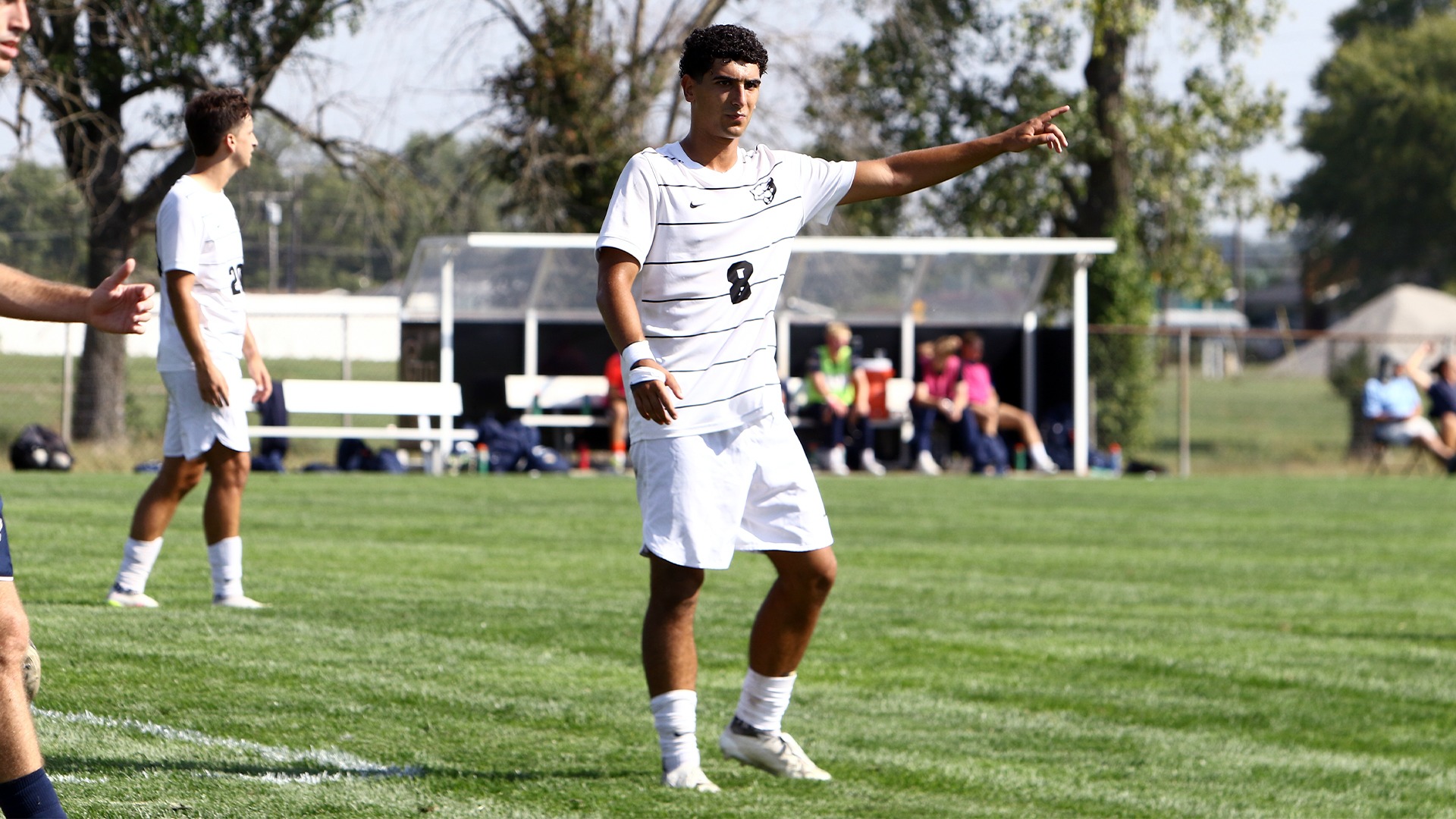 #8 pointing in white jersey 