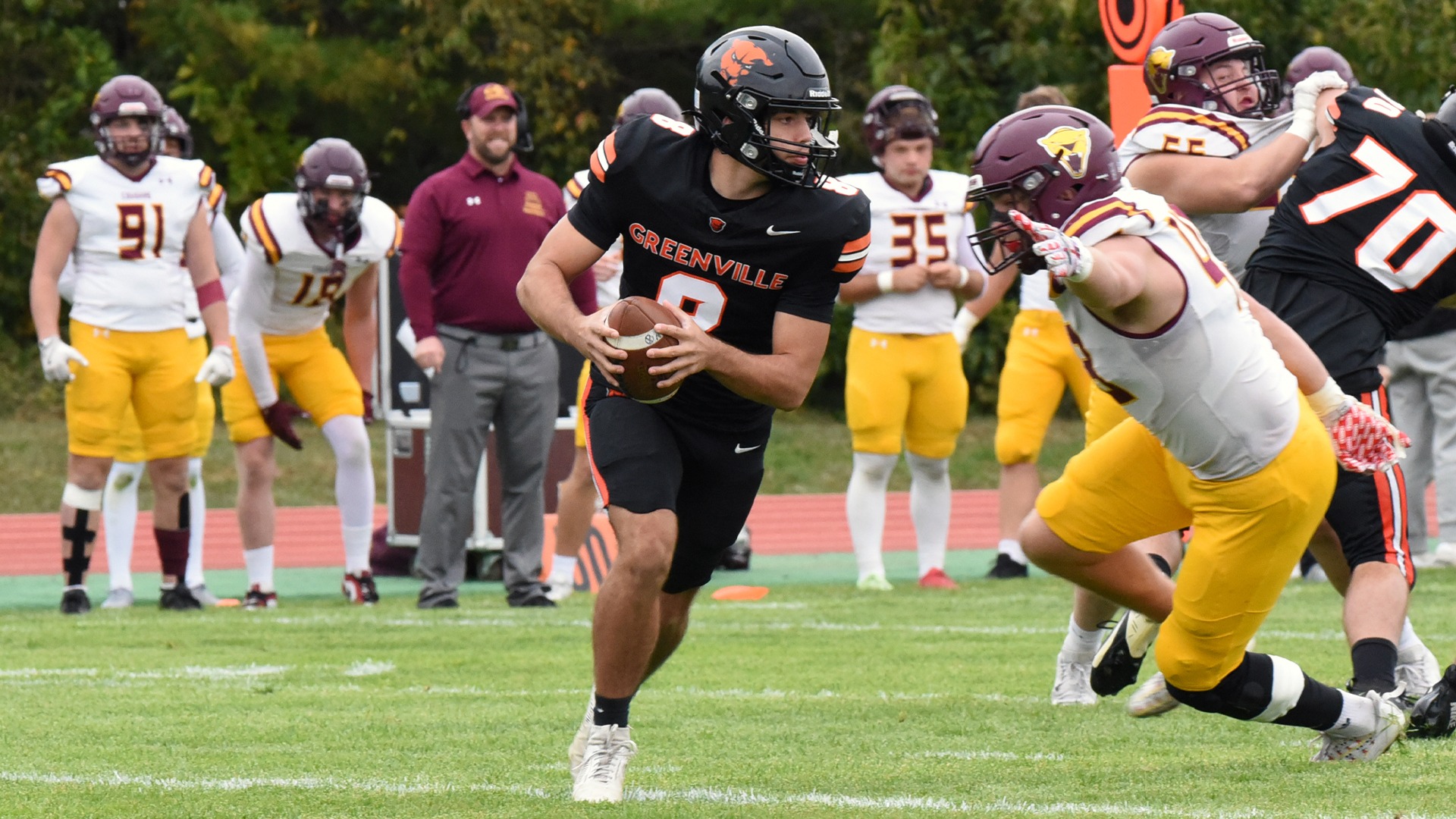 #8 QB in black jersey running ball