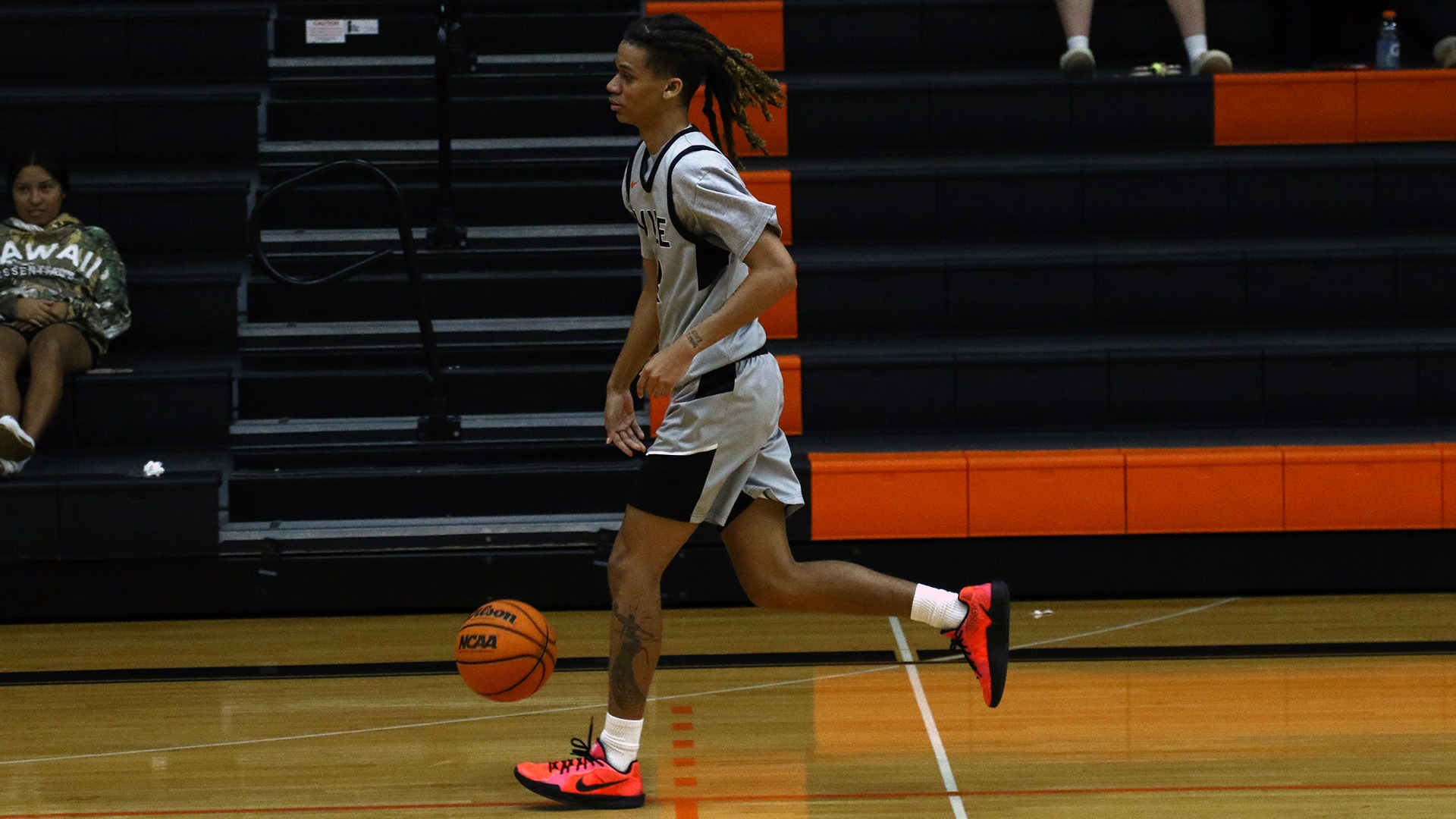 sheldon grant in grey jersey dribbling ball